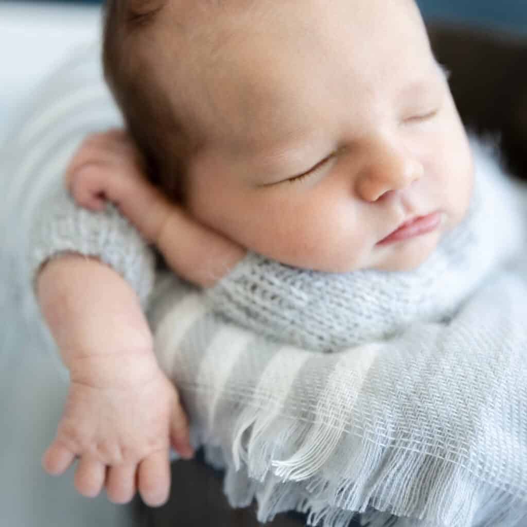 find out about Utah newborn photography packages and get a cute picture like the sleeping baby boy