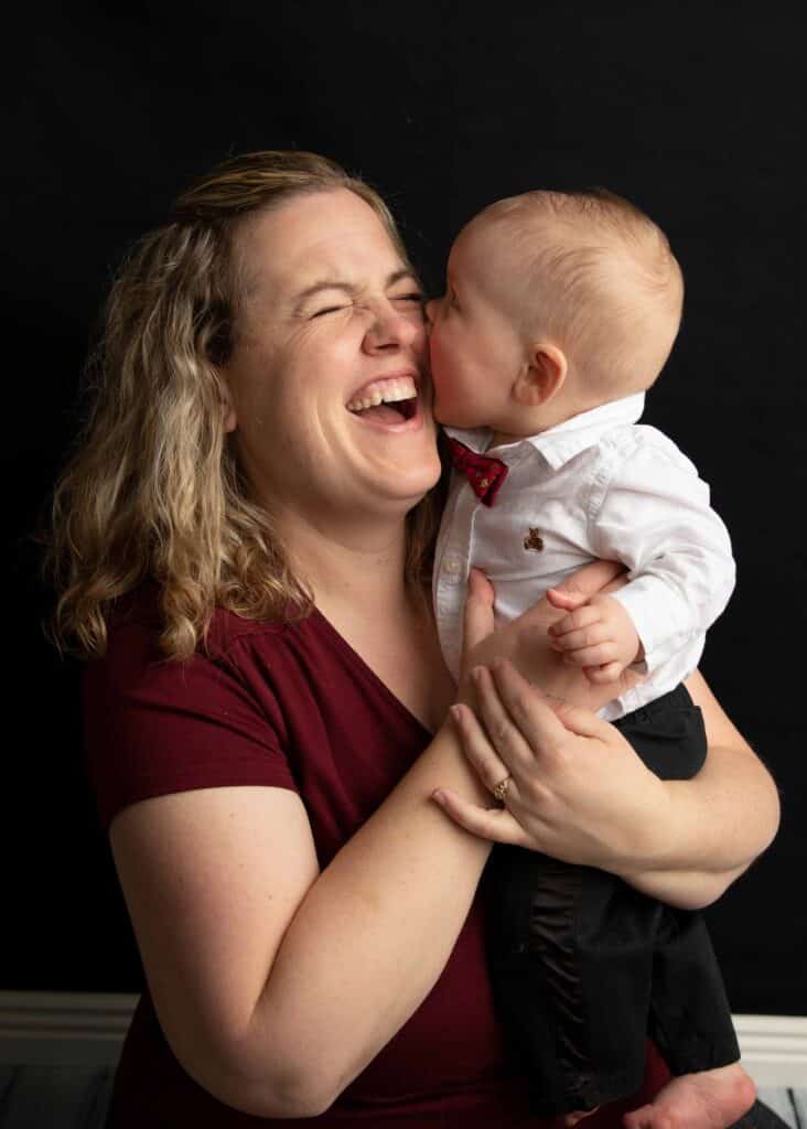 baby boy kissing mom