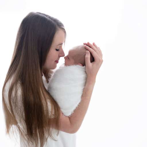 mom snuggling baby