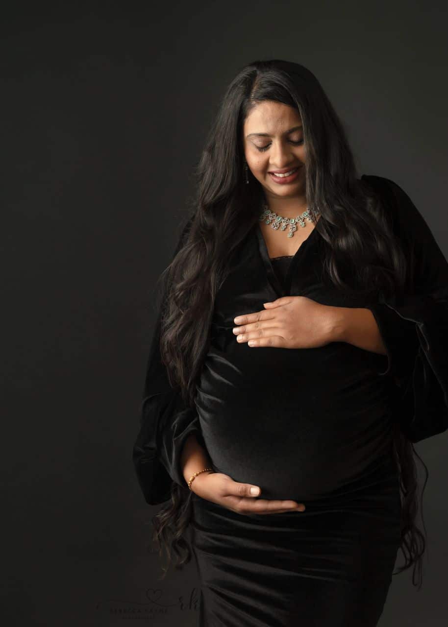 mom in black maternity gown