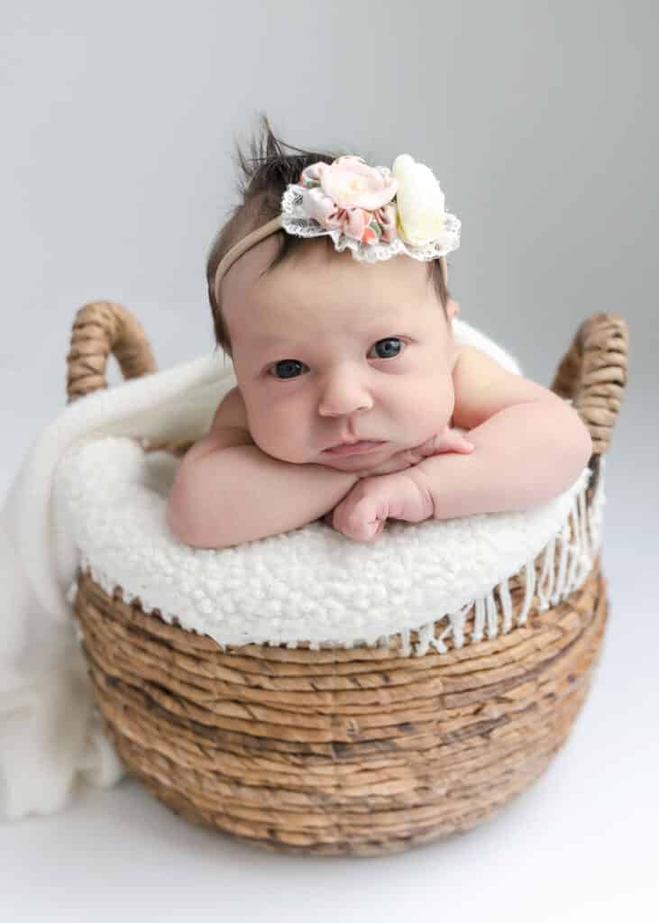 newborn in basket