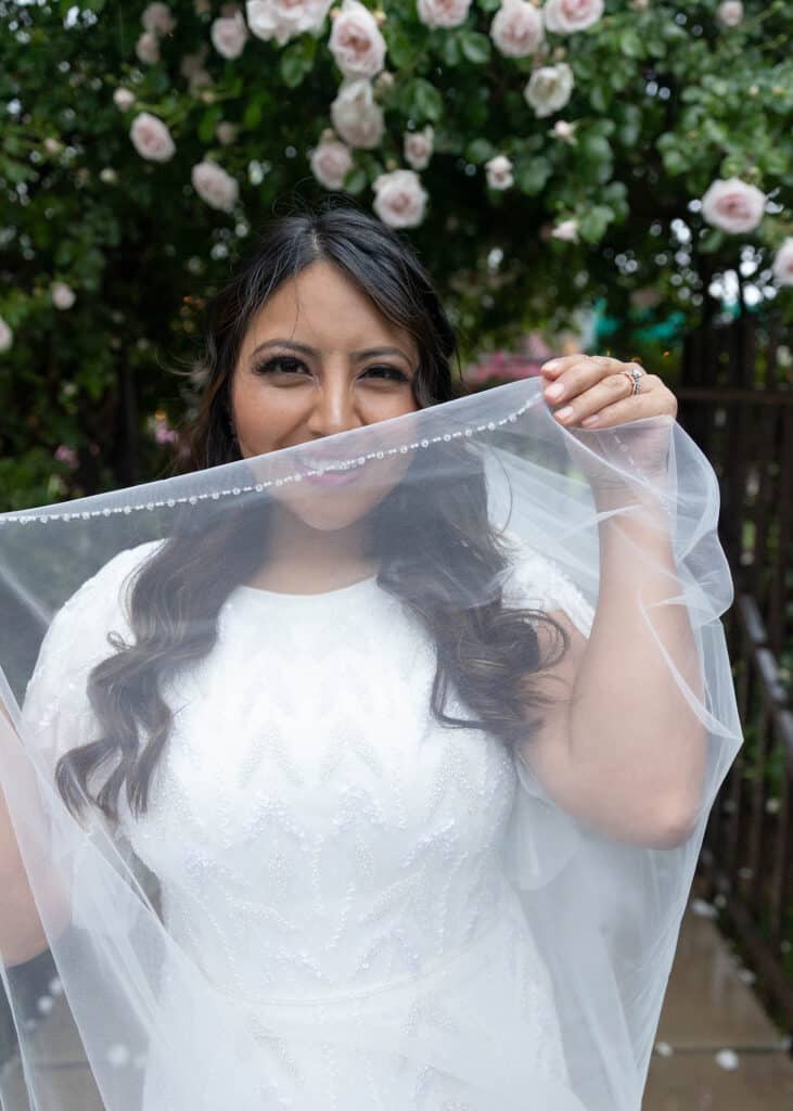 bride hiding behind veil