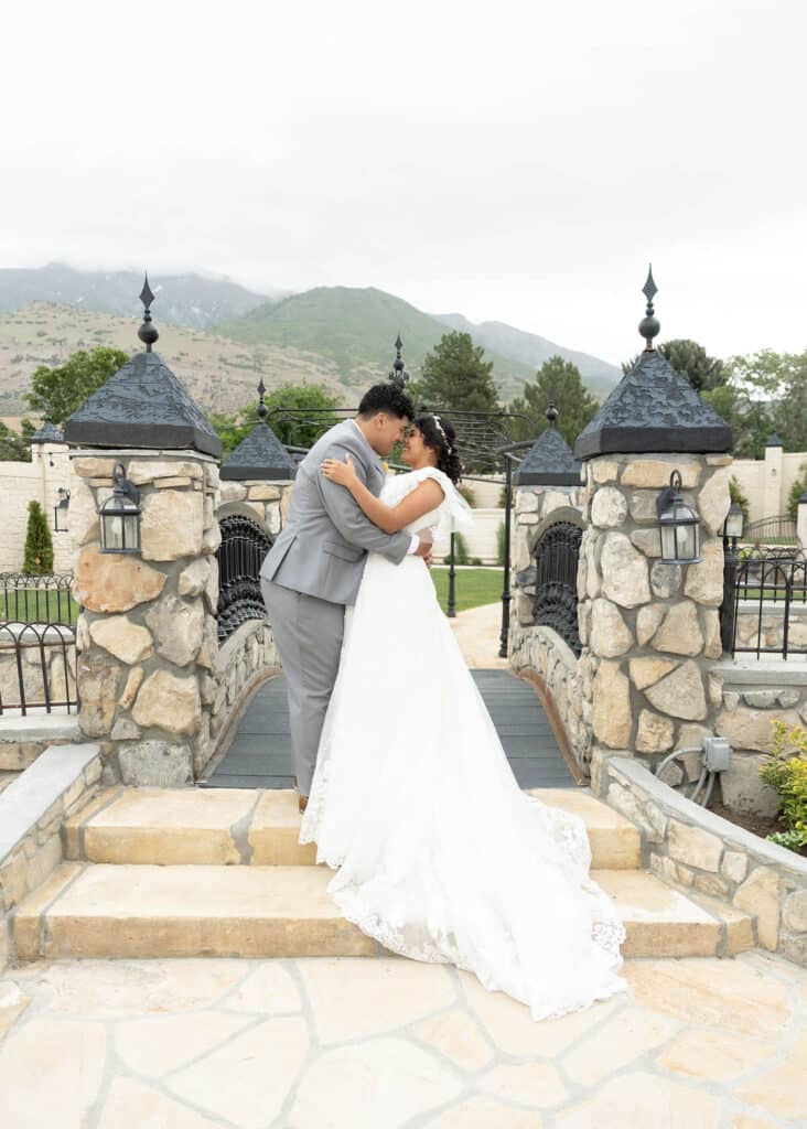 bride and groom kissing on bridge Salt Lake City wedding photographer