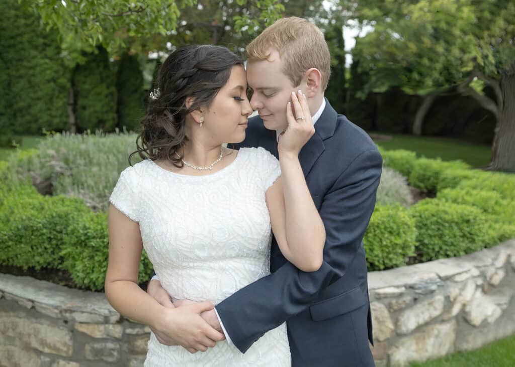 bride snuggling groom's face