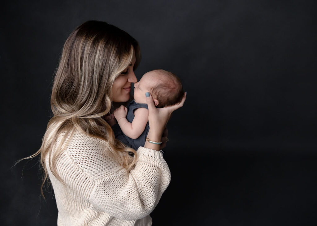 mom snuggling baby nose to nose