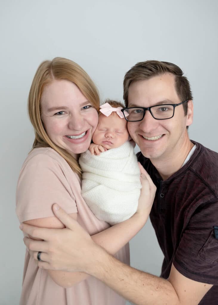 parents with newborn baby girl