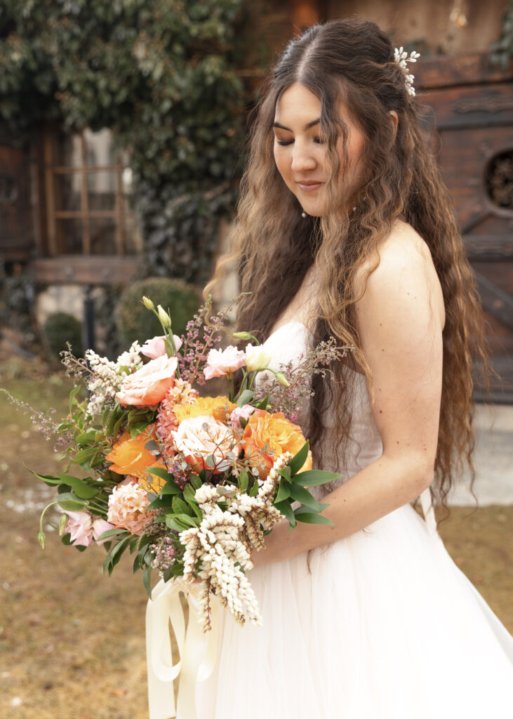 bride with floral bouquet details shot