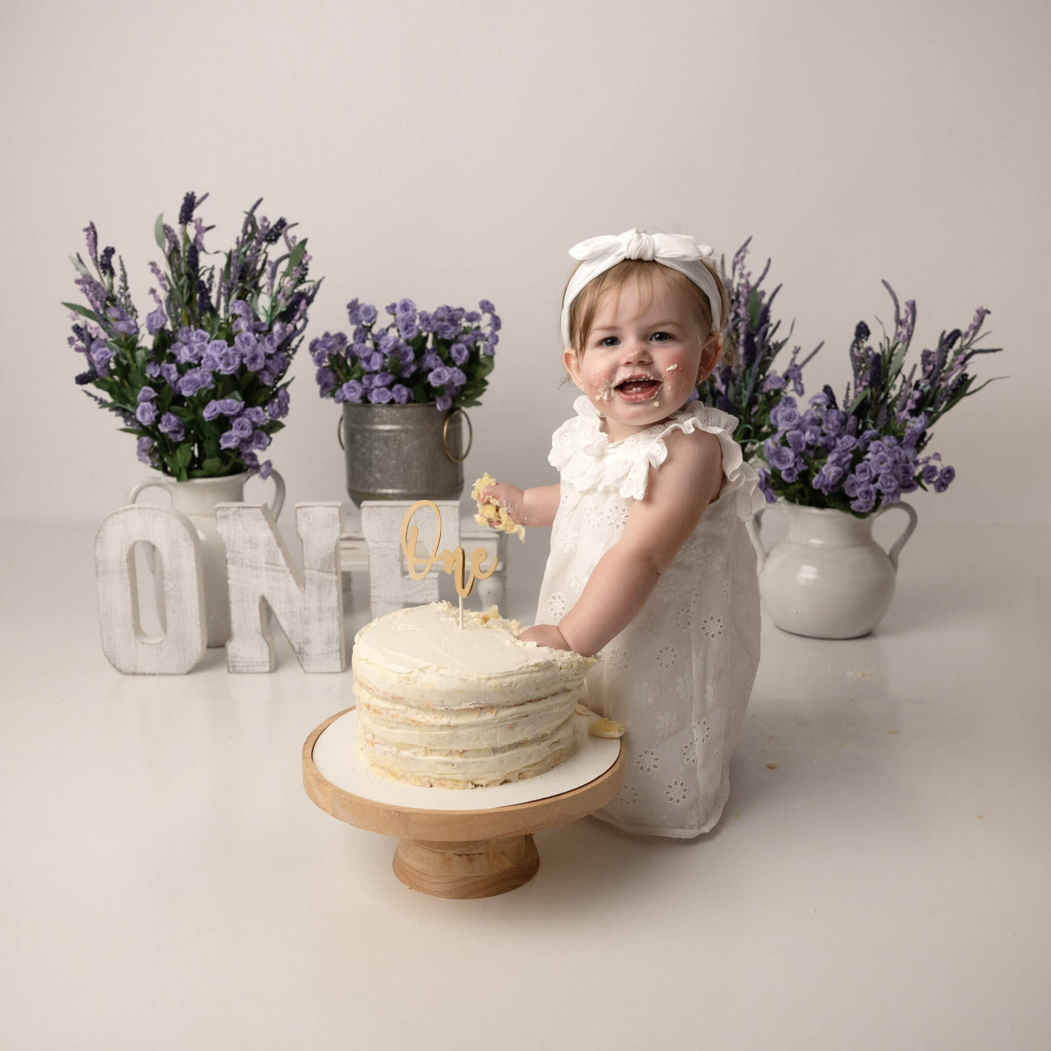 utah county 1st birthday photoshoot purple florals and white vases