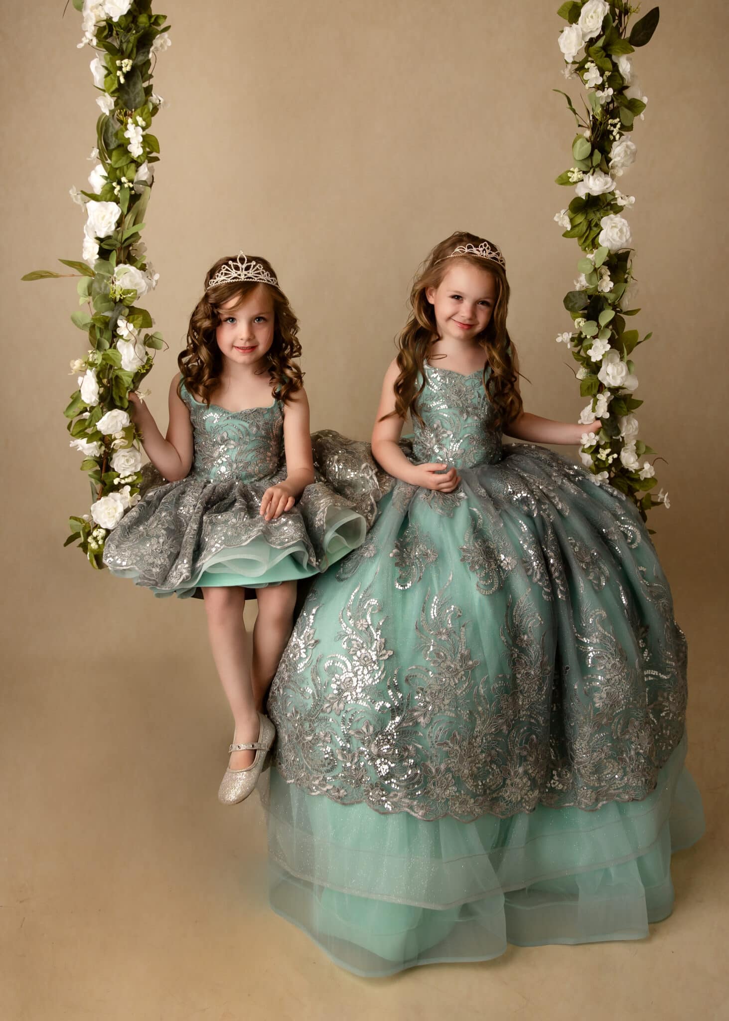 two girls in blue gowns for their princess photography sessions
